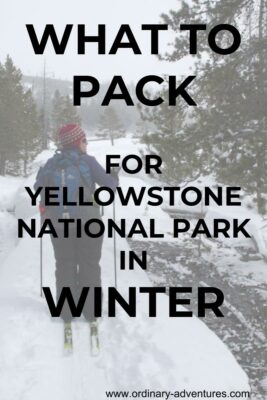 A woman skiing on a trail among trees. She is wearing a red hat and a backpack and looking to the right. Text says What to Pack for Yellowstone National Park in Winter