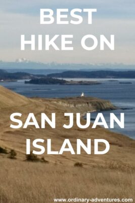 grassy meadow along a shoreline with a lighthouse, islands and mountains. Text reads Best Hike on San Juan Island