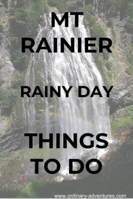 Waterfall over rocks with a rainbow. Text reads: Mt Rainier Rainy Day Things to do