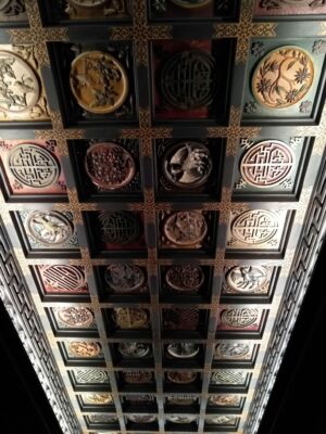 Colorful wooden carvings on a ceiling