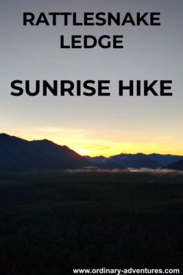 Sunrise behind mountains across a valley. Text reads: Rattlesnake ledge sunrise hike