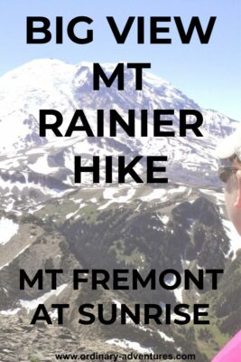 Mt Rainier, a high, snowcapped mountain on a clear day. The side of a woman's face is visible on the side. She is wearing a hat and sunglasses and looking at the mountain. Text reads: Big view Mt Rainier hike, Mt Fremont at Sunrise