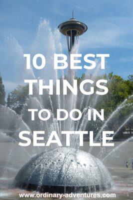 A fountain is spraying in front of green trees and the Space Needle. Text reads: 10 best things to do in seattle