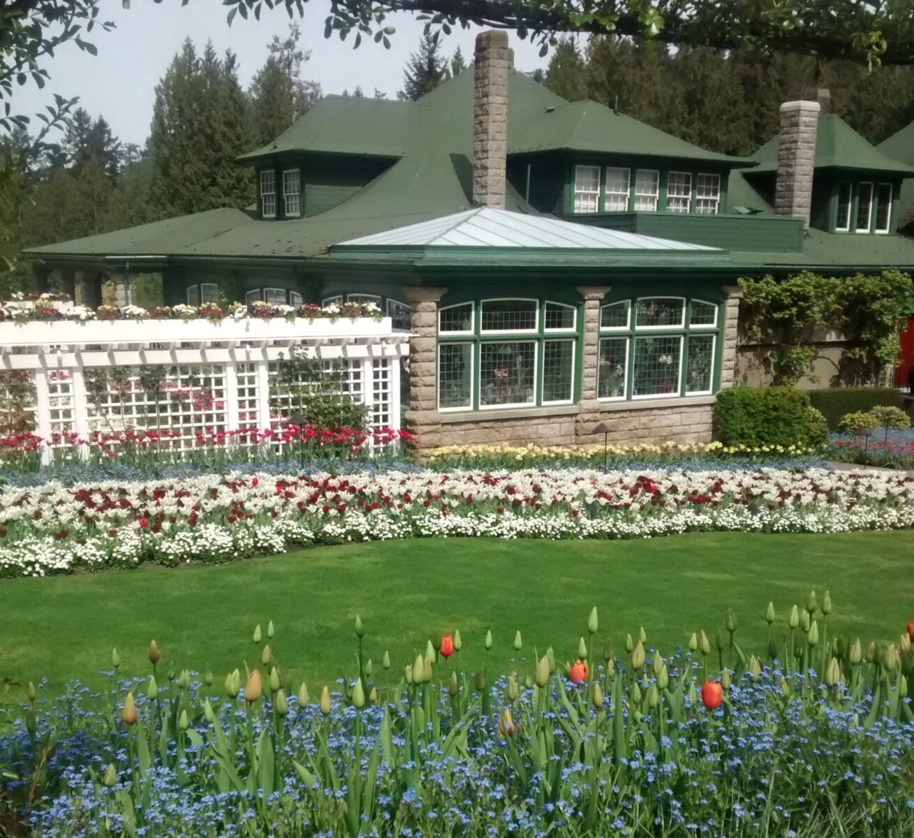 A historic home surrounded by formal gardens at Butchart Gardens in Victoria, a popular day trip from Seattle