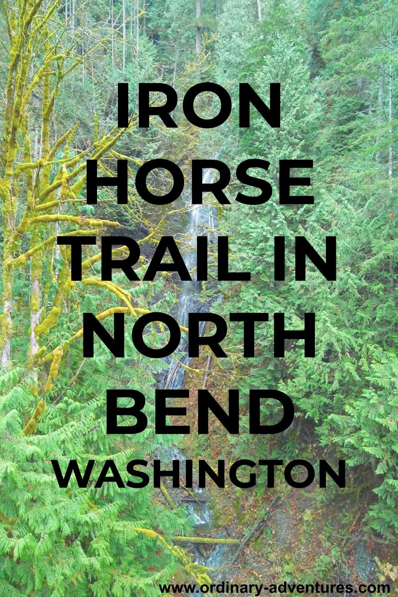 Green forest surrounds a narrow, high waterfall. Text reads Iron Horse Trail in North Bend