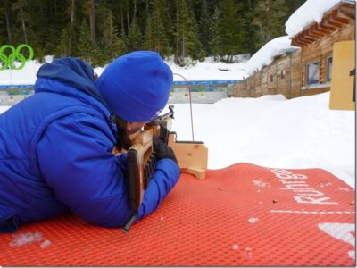 A person holds a gun designed for use in the Olympic Sport of Biathlon on the Biathlon range to learn a new Olympic sport, one of many on offer at Whistler Olympic park