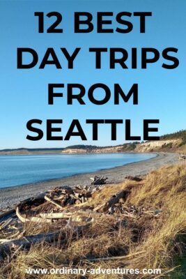 The beach on Whidbey Island on a sunny day. Text reads 12 best day trips from Seattle