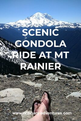 A person's feet in the foreground on the ridge looking out towards Mt Rainier from the summit of the crystal mountain gondola. Text reads: Scenic gondola ride at Mt Rainier