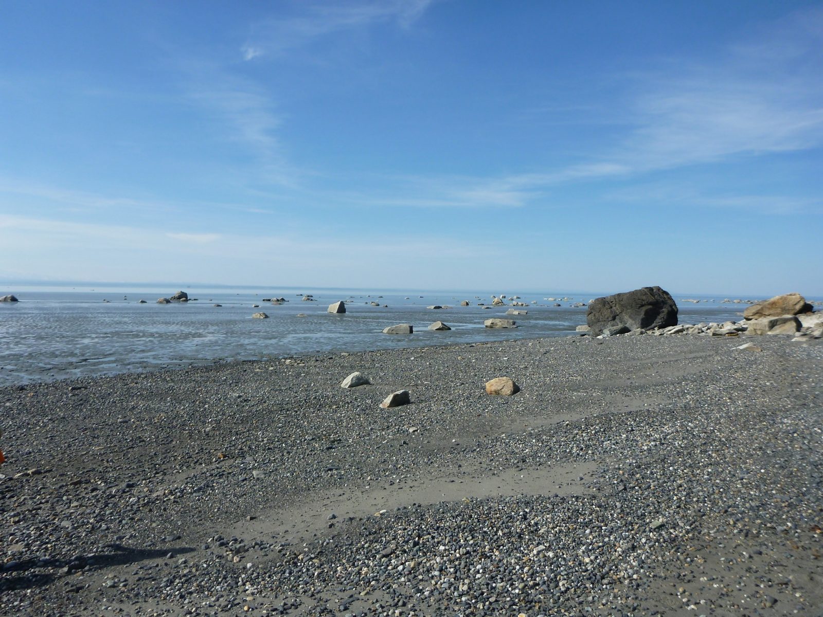 Camping in Alaska at the Captain Cook Campground has a gravel beach on a large body of ocean water