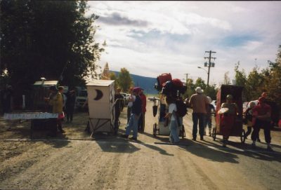 A quirky thing to do in Dawson City is the annual outhouse race. Here four outhouses decorated and on wheels line up at the start on a gravel street in town