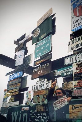 Lots of road signs on top of each other in the Watson lake signpost forest.